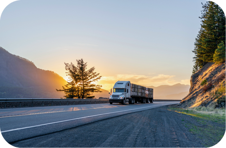 Porter Freight Funding | Freight Factoring Solutions for Trucking Companies Semi-truck on open highway at sunrise representing Porter Freight Funding’s freight factoring solutions for trucking companies.