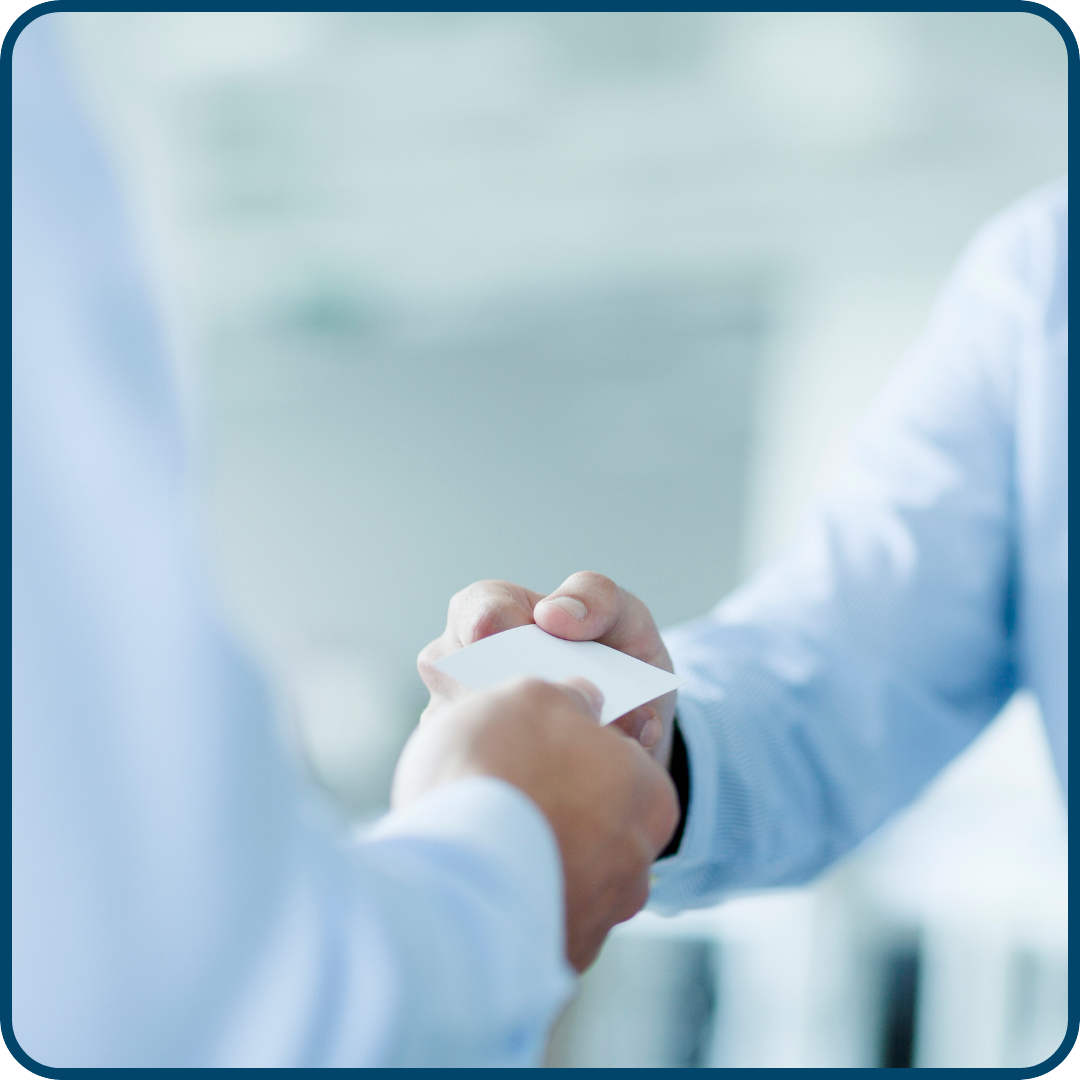 Two people shaking hands representing a trucking referral partnership with Porter Freight Funding