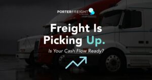 Porter Freight Funding graphic reading "Freight Is Picking Up. Is Your Cash Flow Ready?" over an image of parked semi trucks with an upward trend arrow